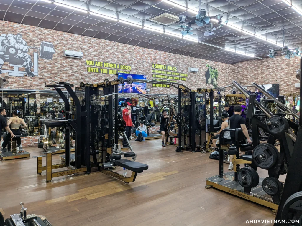 People using various exercise machines inside CLB Fitness T&V in Ho Chi Minh City