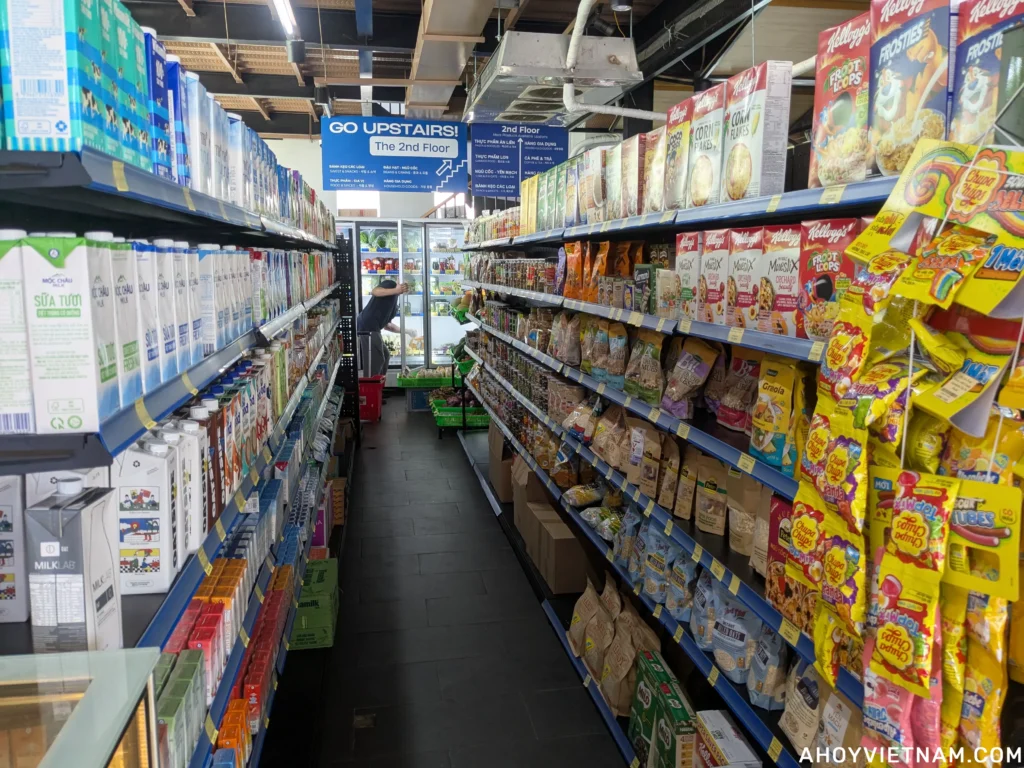 An aisle of milk, cereal, and oatmeal at MOONMILK supermarket in Da Nang.