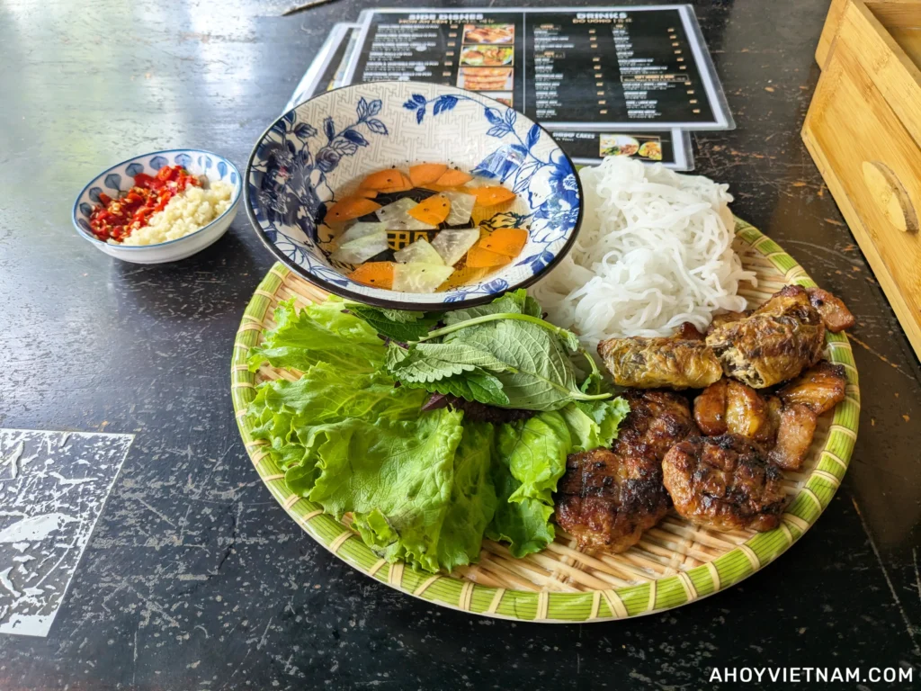 My plate of bun cha and spring rolls from Bun Cha Quyen's House, one of my favorite places to eat in Da Nang, Vietnam