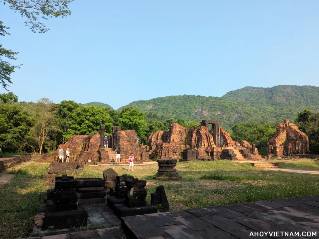 A family exploring some of the ruins at My Son Sanctuary