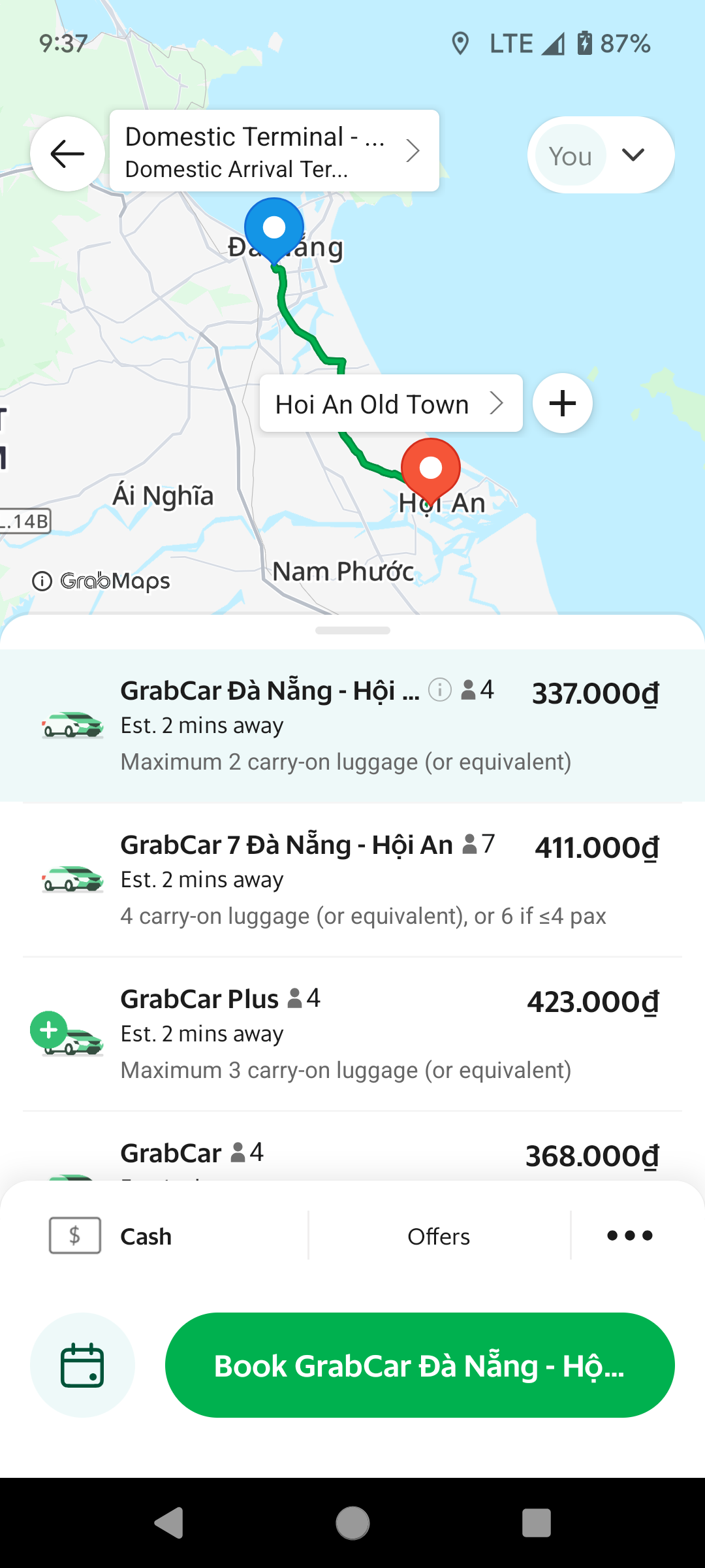 A screenshot of a Grab app trip from Da Nang International Airport to Hoi An Old Town.