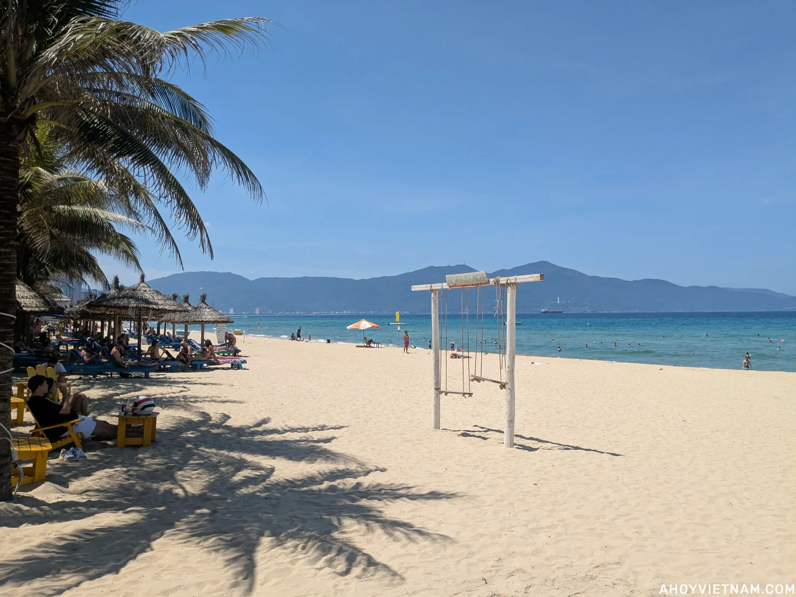 A wooden swing on the sand of My Khe Beach in Da Nang in May.