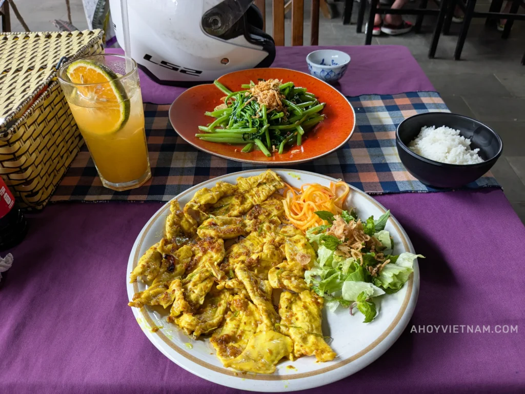 Juice, morning glory, chicken, and rice at the Purple Lantern Restaurant at An Bang Beach in Hoi An.