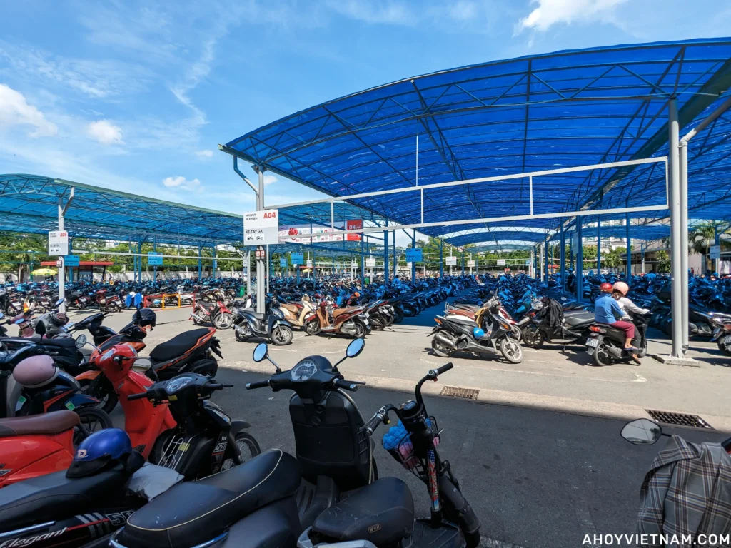 Hundreds of scooters in the outdoor parking lot at Lotte Mart in District 7, Ho Chi Minh City.