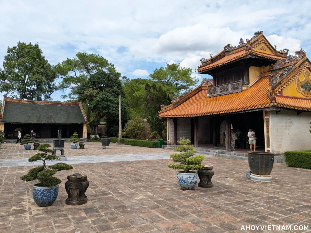 Buildings and bonsai trees at the Mausoleum of Emperor Tu Duc in Hue, Vietnam.