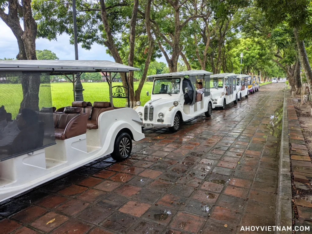 Parked electric golf carts that shuttle tourists inside Hue Imperial City
