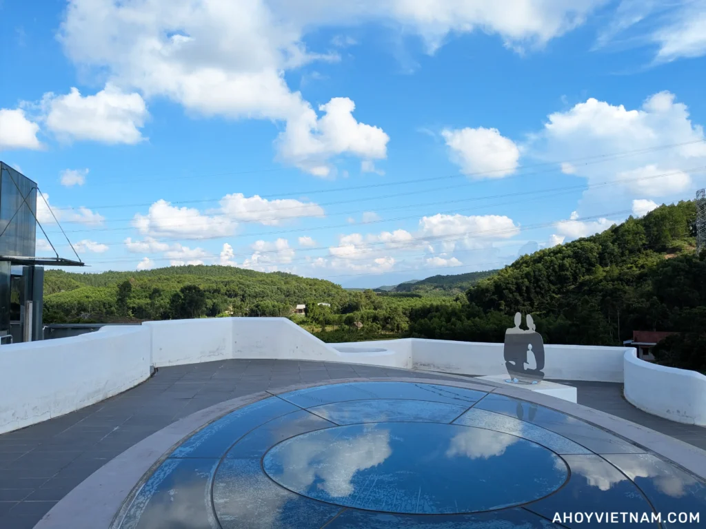 Standing on the rooftop of Lebadang Memory Space, looking at the mountains and countryside in Hue, Vietnam