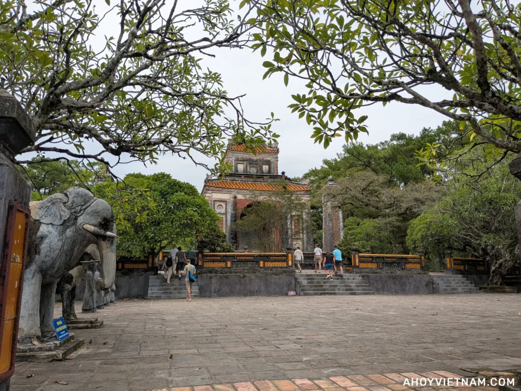 Tourists walking on the grounds at Tu Duc's tomb in Hue, Vietnam