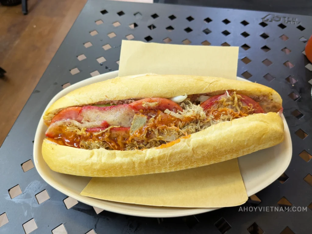 Eating a banh mi sandwich in Hanoi