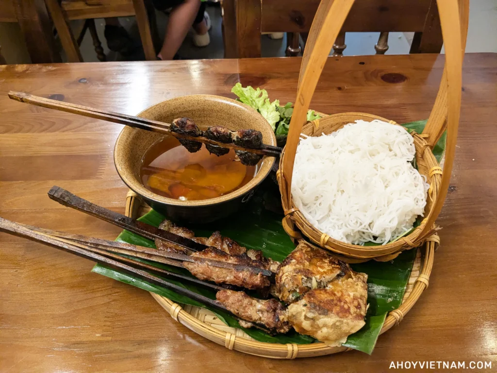 Eating bun cha at O Bun Cha in Hanoi, Vietnam