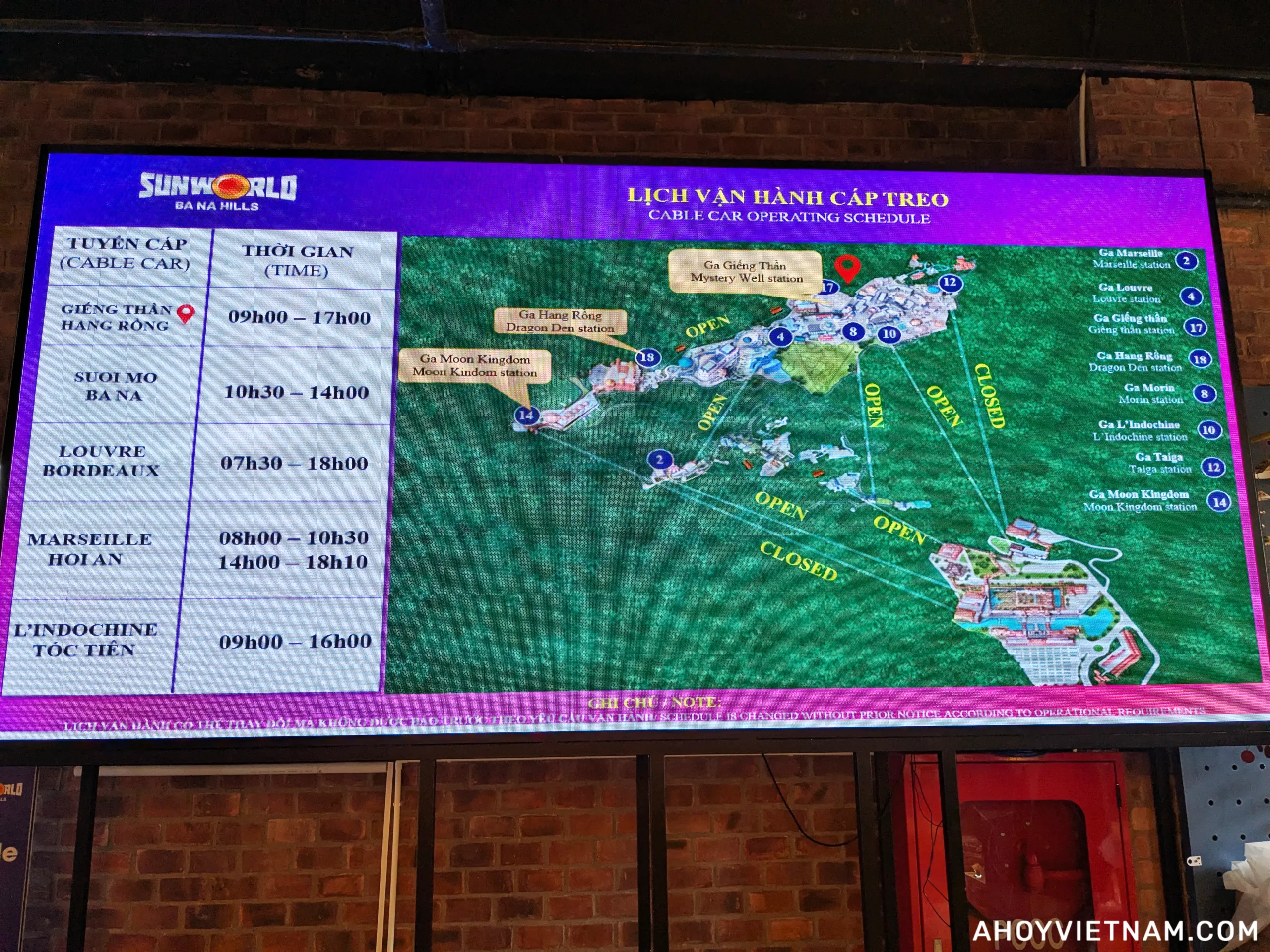 A digital screen showing the cable car operating schedule inside Ba Na Hills in Da Nang