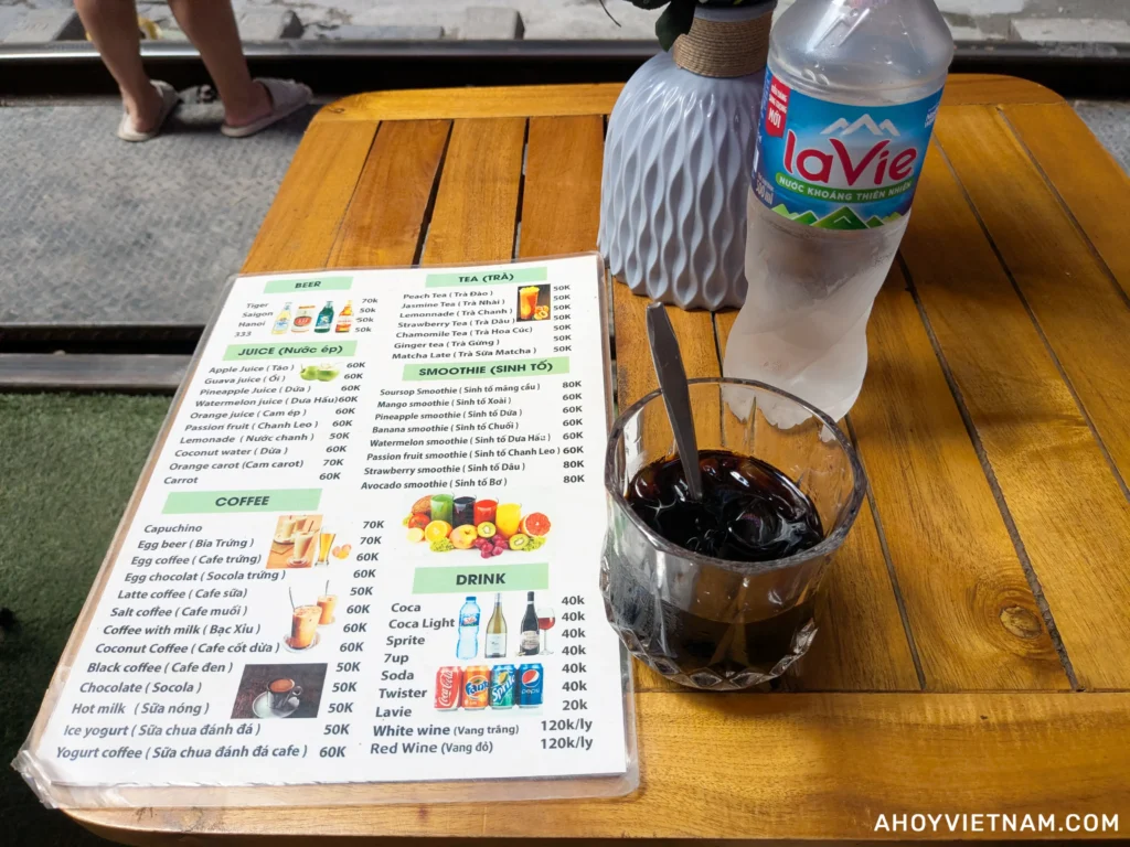 My black iced coffee and bottle of water at Hanoi Train Street in Vietnam