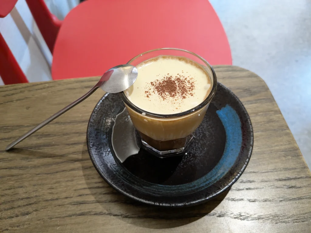 Drinking a Vietnamese hot egg coffee in Hanoi