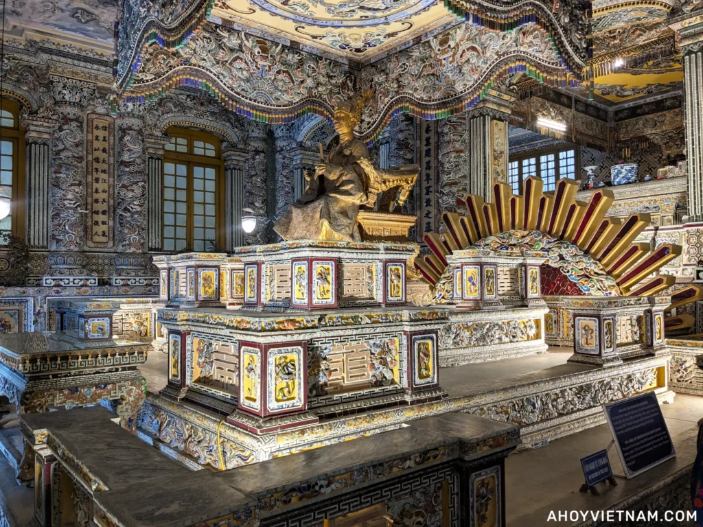 The bronze gilded statue of Emperor Khai Dinh inside his tomb in Hue, Vietnam