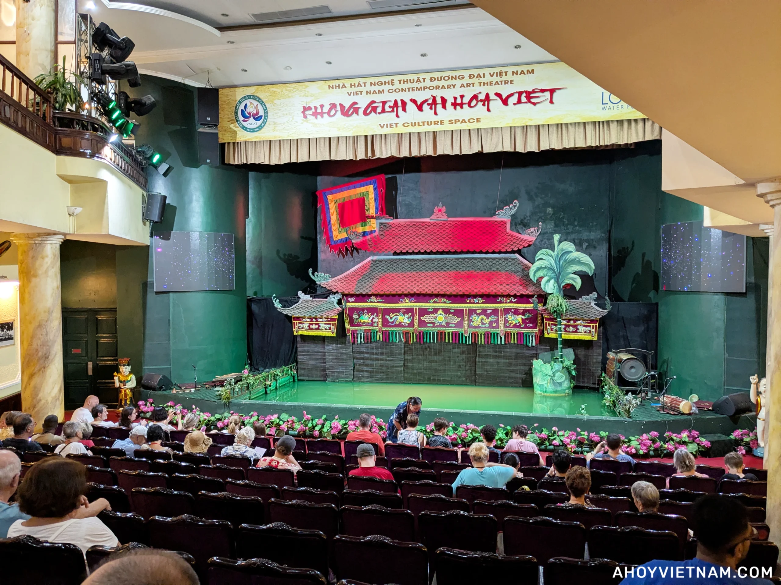 Guests taking their seats inside the Lotus Water Puppet Theatre in Hanoi, Vietnam
