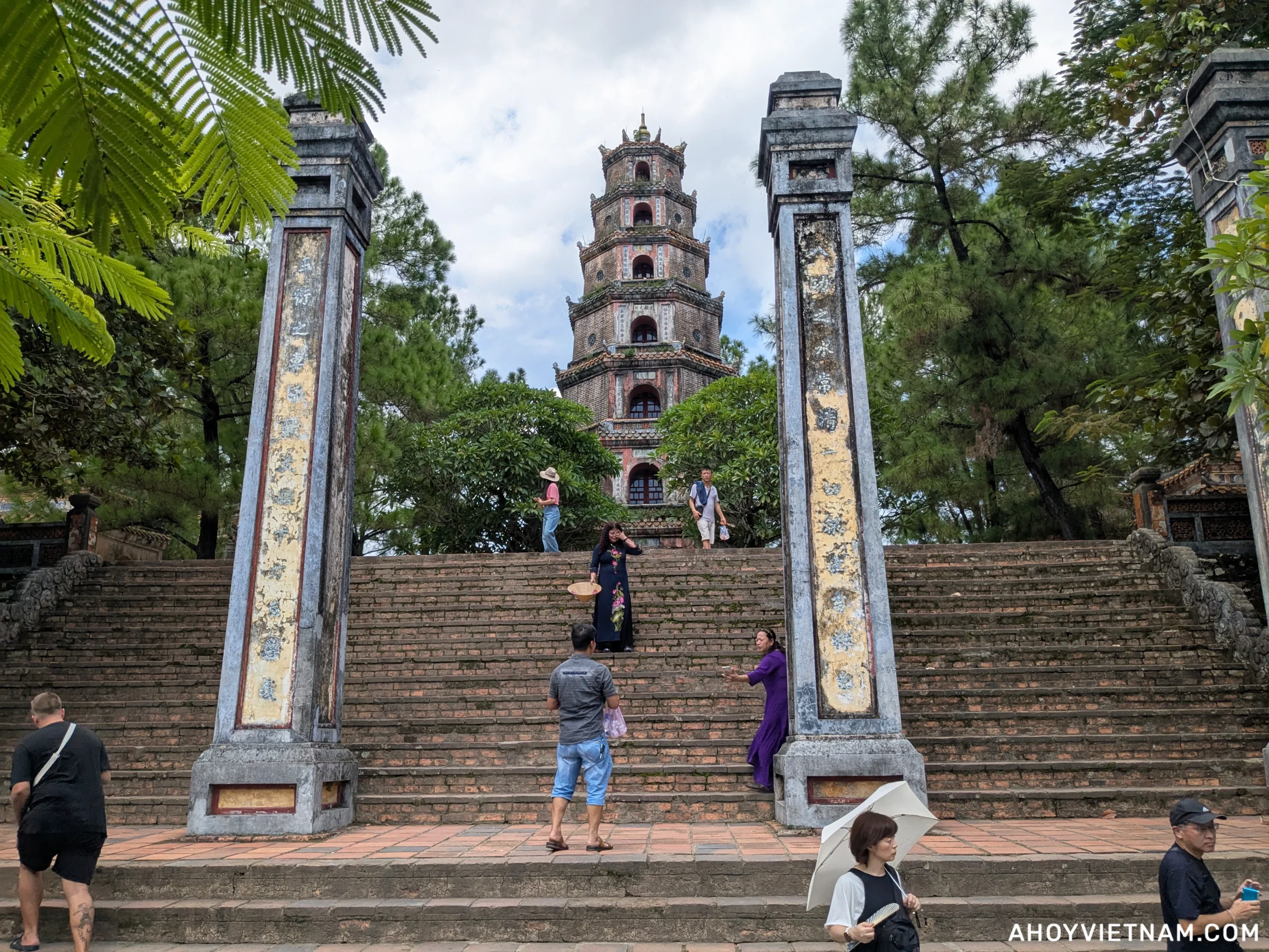 Visitors on the front steps of the Thien Mu Pagoda in Hue, Vietnam