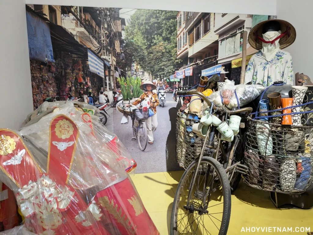A display at the Vietnamese Women's Museum in Hanoi showing a woman selling goods on a bicycle