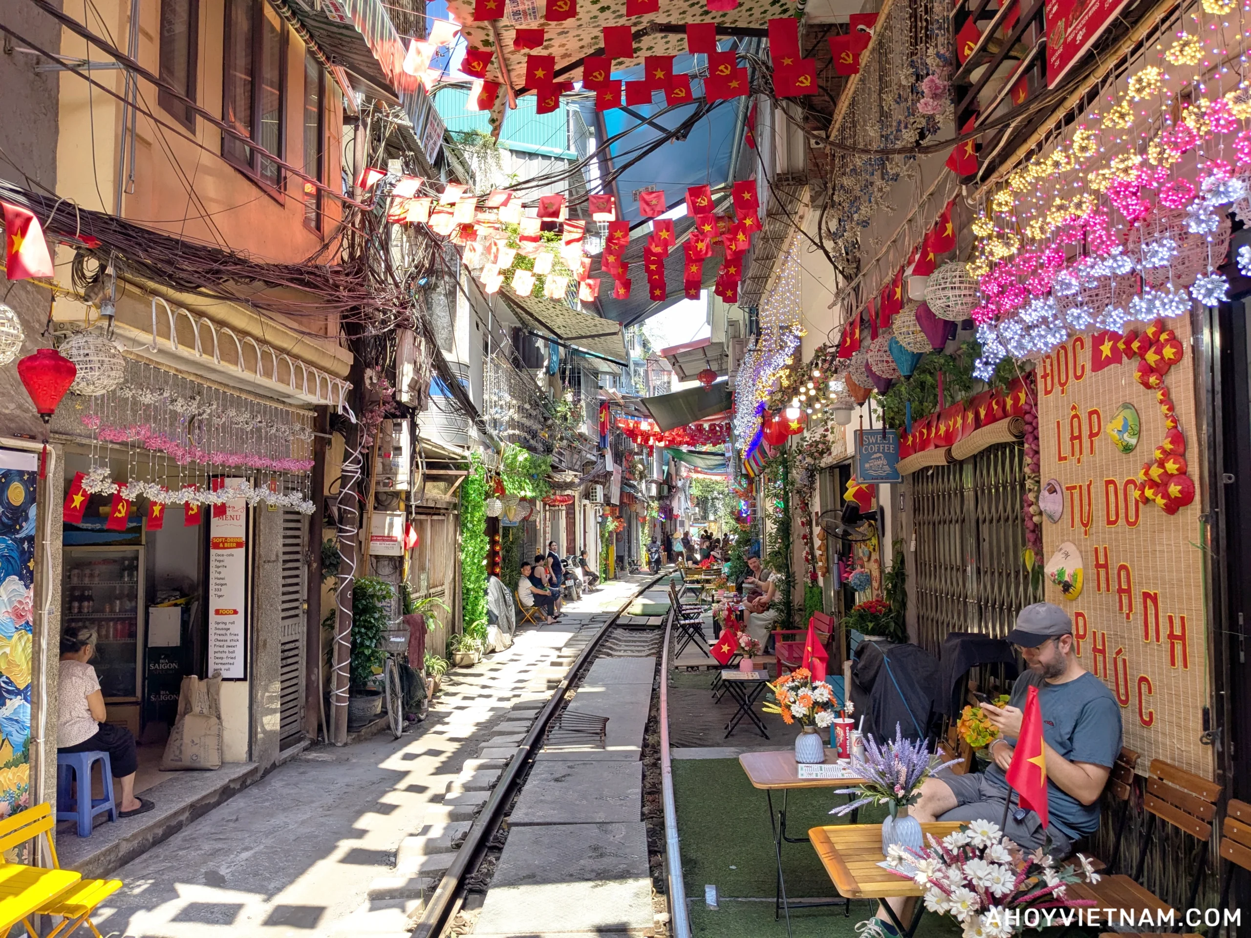 Standing on the tracks at Hanoi Train Street in Vietnam