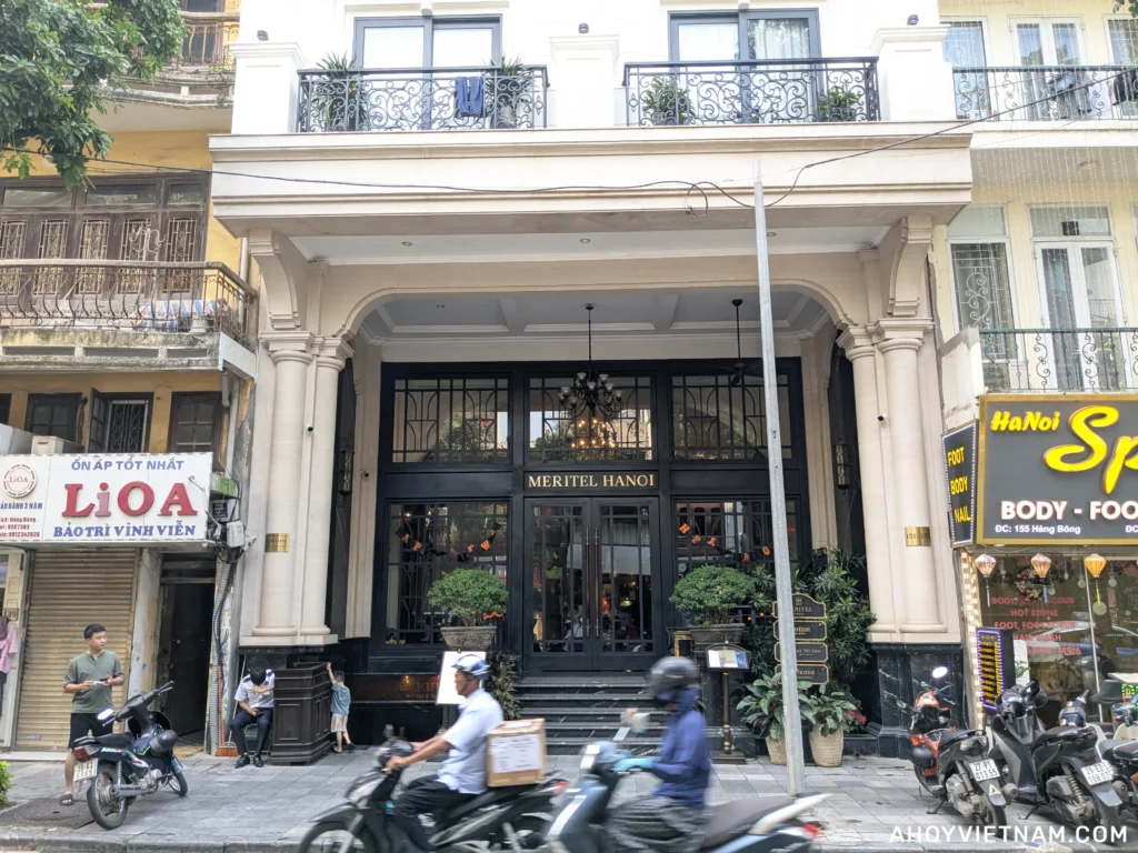 Scooters driving in front of the Meritel Hanoi Hotel in Vietnam
