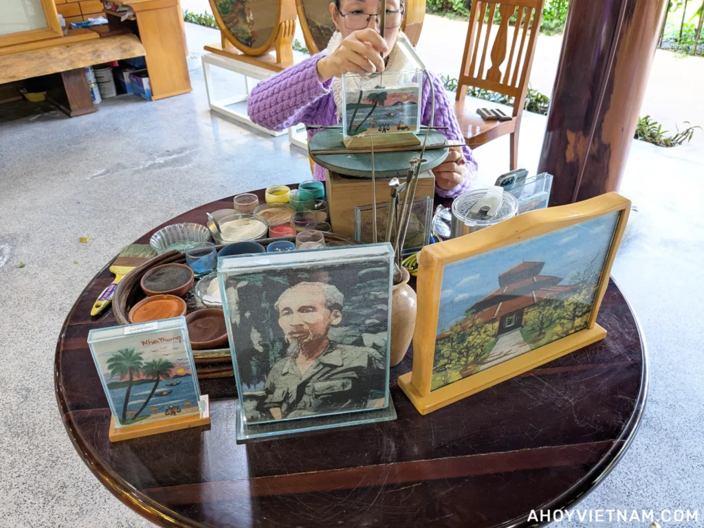 A Vietnamese woman making sand art at Truong Son Craft Village in Nha Trang, Vietnam