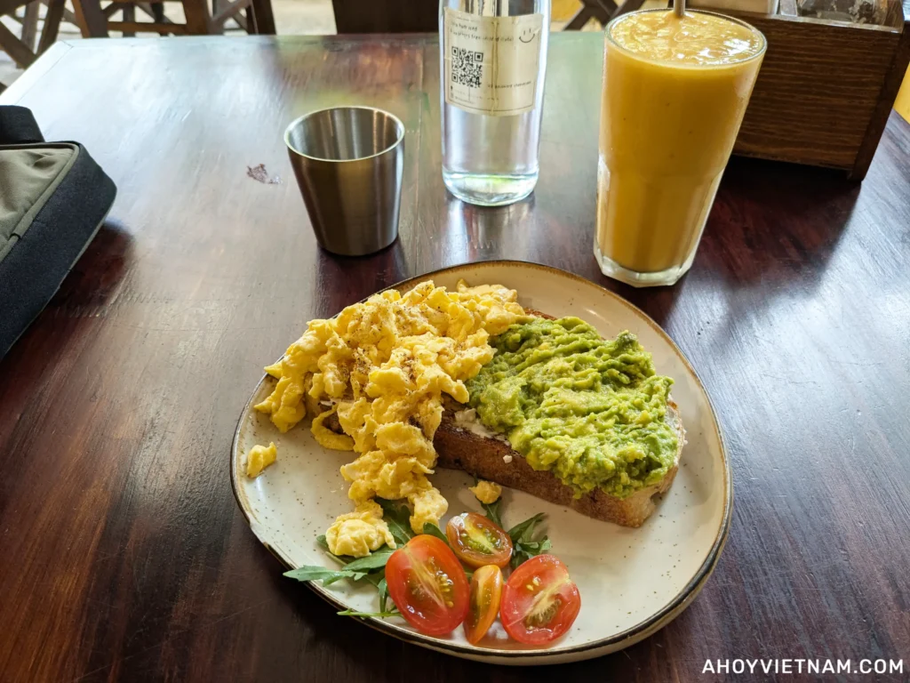 Scrambled eggs and avocado on toast, and a smoothie at Fika Cafe and Bookstore in Hoi An