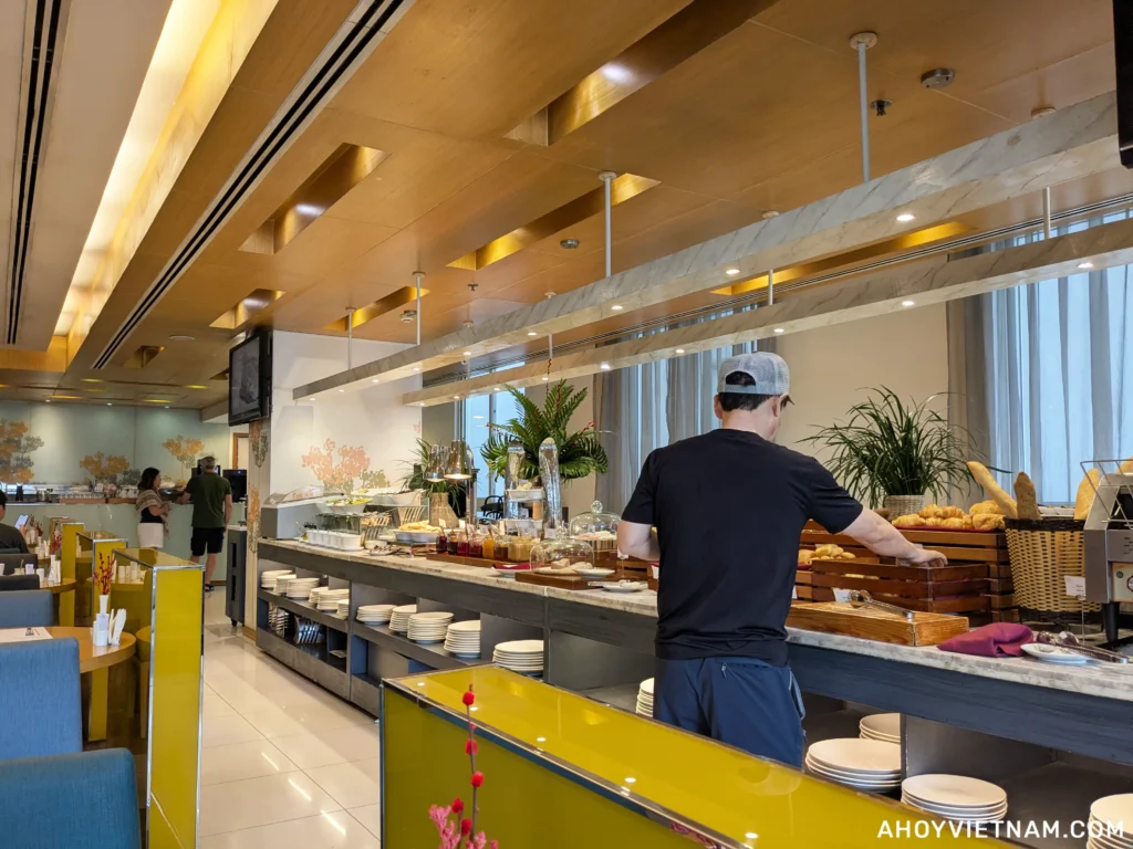 A guest at the Liberty Central Saigon Centre Hotel eating at the breakfast buffet