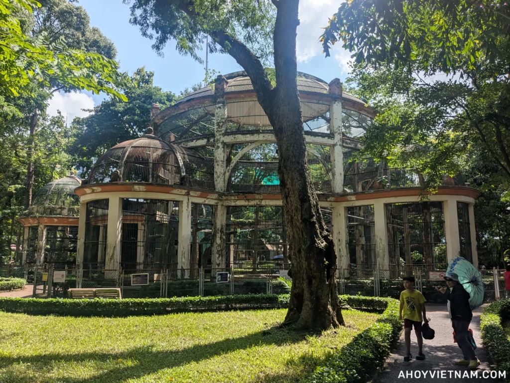 An older structure that houses birds and monkeys at the Saigon Zoo in Ho Chi Minh City